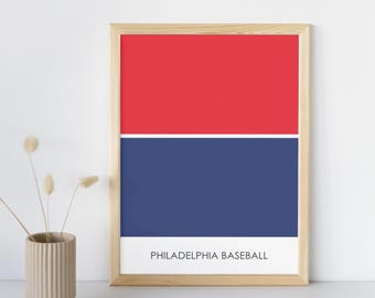 May include: A framed print with a red and blue color block design. The print has the text "PHILADELPHIA BASEBALL" at the bottom.