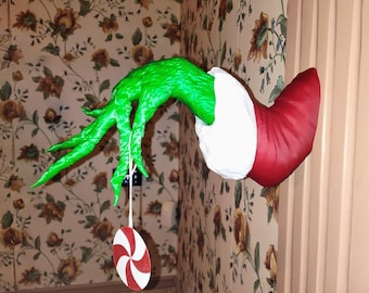 Colgador de pared con forma de mano del Grinch