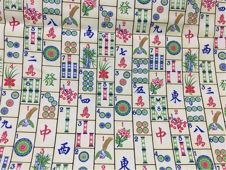 May include: A colourful fabric with a repeating pattern of mahjong tiles. The tiles feature various Chinese characters and numbers, along with bamboo, flowers, and circles. The background is a light yellow colour.