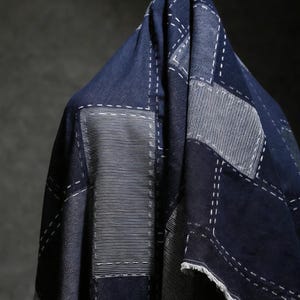 May include: A rustic wooden sign with the text "Welcome to our home" in white lettering. The sign has a distressed finish and a simple, inviting design, ideal for entryway decor.