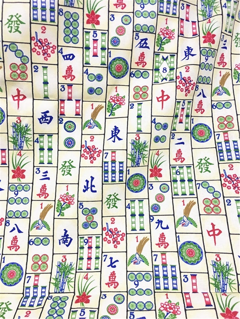 May include: A colourful fabric with a repeating pattern of Chinese mahjong tiles. The tiles feature various Chinese characters and numbers, along with bamboo, flowers, and circles. The fabric is a light beige colour with green, red, blue, and black accents.