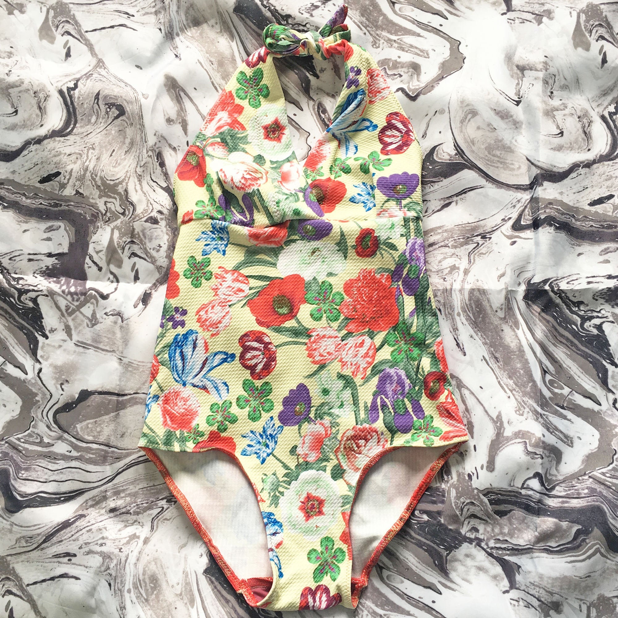 cream swimming costume