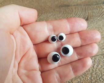 German squinting glass eyes. 1 pair. Teddy bear eyes. Squinting glass eyes with a loop on back