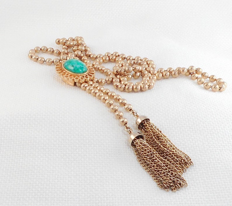 Delizza and Elster for Avon Ming Green Slide Tassel Necklace 1973 Ming Green D /& E Lariat Peking Glass Tassel Necklace Book Item Necklace