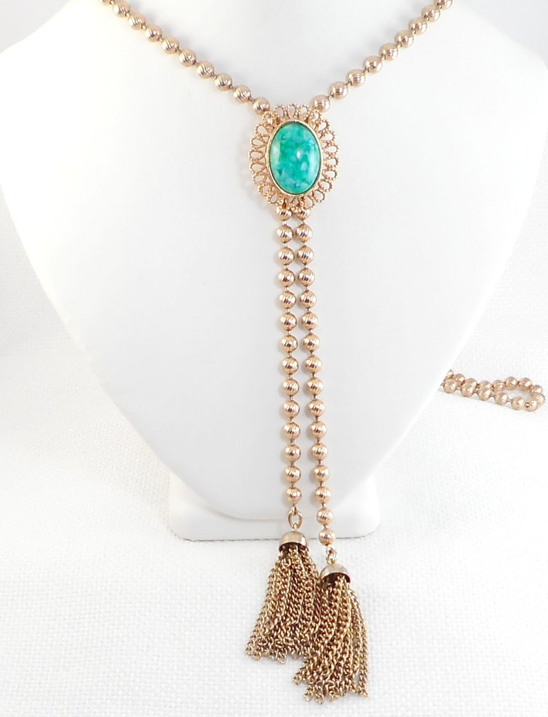 Delizza and Elster for Avon Ming Green Slide Tassel Necklace 1973 Ming Green D /& E Lariat Peking Glass Tassel Necklace Book Item Necklace