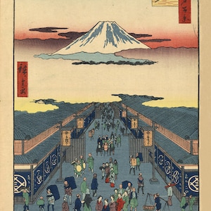 May include: A woodblock print depicting a bustling street scene in Japan. The street is lined with shops and stalls, and people are walking, riding horses, and carrying goods. In the distance, Mount Fuji rises above the clouds. The print is titled "The Street of Edo" and is signed by the artist, Hiroshige.