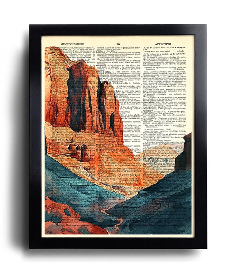 Puede incluir: Una pintura de acuarela de un paisaje de ca&ntilde;&oacute;n con formaciones rocosas rojas y naranjas y un valle azul y verde. La pintura se superpone a una p&aacute;gina de un diccionario antiguo con la palabra "afectivo" visible.