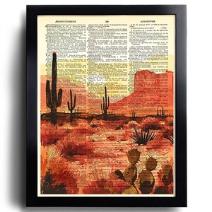 Puede incluir: Una pintura de paisaje des&eacute;rtico con un cielo de puesta de sol, cactus y una monta&ntilde;a en el fondo. La pintura est&aacute; impresa en una p&aacute;gina de diccionario vintage con las palabras "Aeschynomene" y "Affective" visibles.