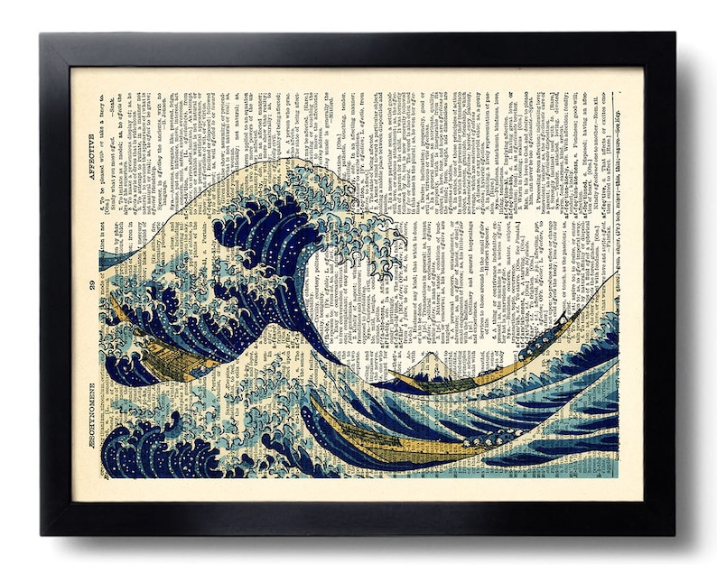 May include: A framed print of a Japanese woodblock print depicting a large wave crashing over a boat. The wave is blue and white, and the boat is small and red. The print is set against a background of a dictionary page.