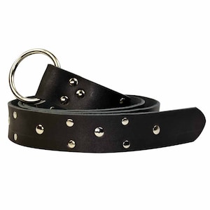 May include: A black leather belt with silver studs and a large silver ring buckle.