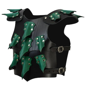 May include: Black leather armor with green leather dragon scales. The armor has straps and buckles.