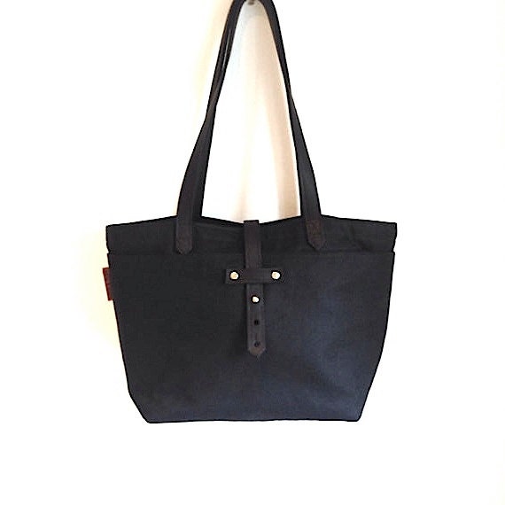 Items similar to Black waxed canvas tote with leather handles. Strong