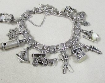 Sterling Silver Charm Bracelet with Interesting Charms +