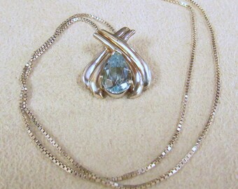 Elegant Sterling Silver and Teardrop Blue Topaz Necklace +