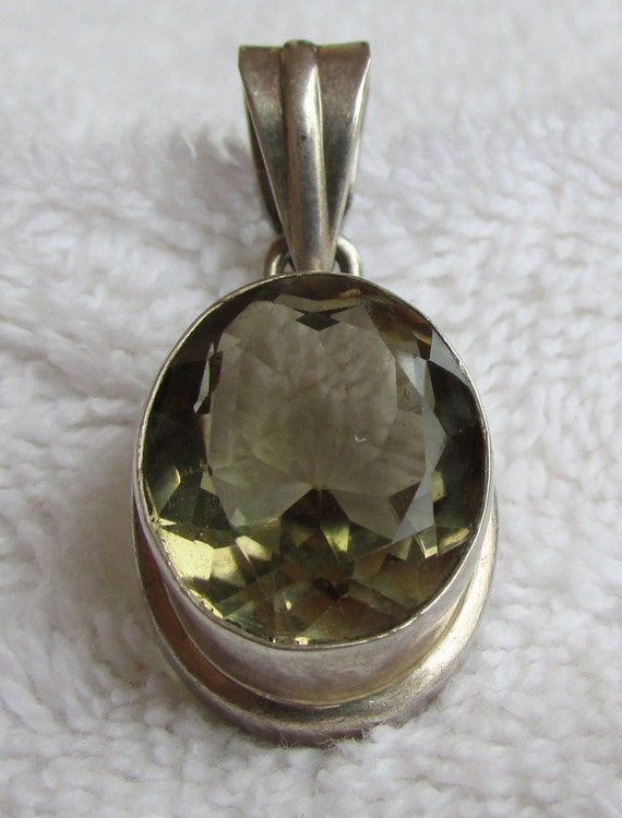 Pretty Faceted Topaz and Sterling Silver Pendant +