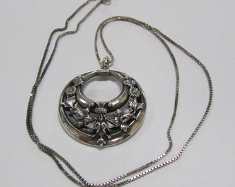 Sterling Silver Necklace with Floral Round +