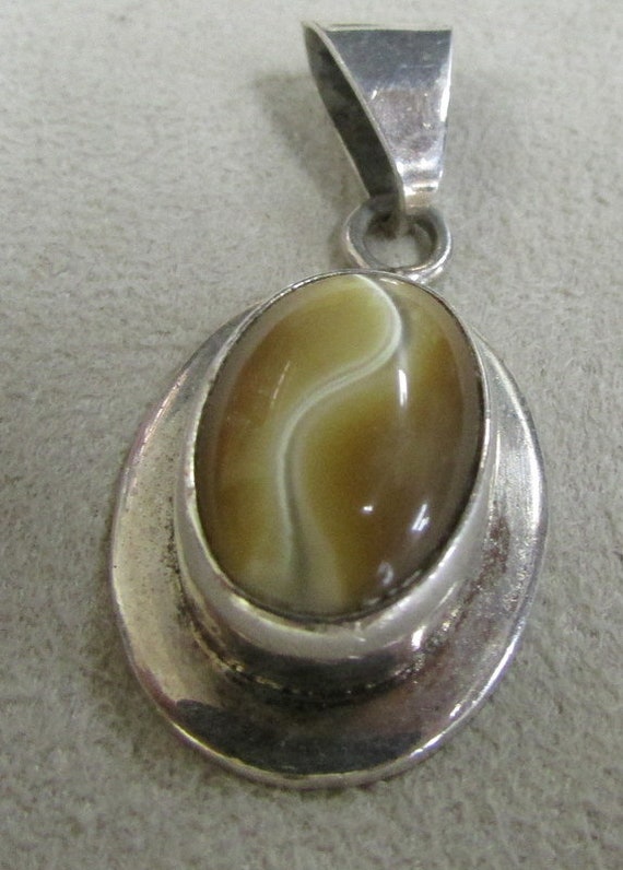 Sterling Silver and Unusual Gold Color Pendant +
