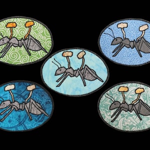 May include: Five embroidered patches featuring a cartoon ant with a mushroom growing on its head. The patches are on different coloured backgrounds with different patterns. The ant is grey, the mushroom is orange and white, and the backgrounds are green, blue, and light blue.