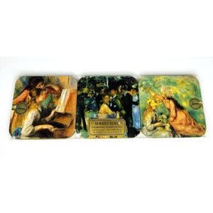 May include: Set of three square coasters featuring famous Impressionist paintings. The coasters depict scenes of people at a piano, a crowded cafe, and a woman with flowers. Each coaster has a gold-colored border and a logo.