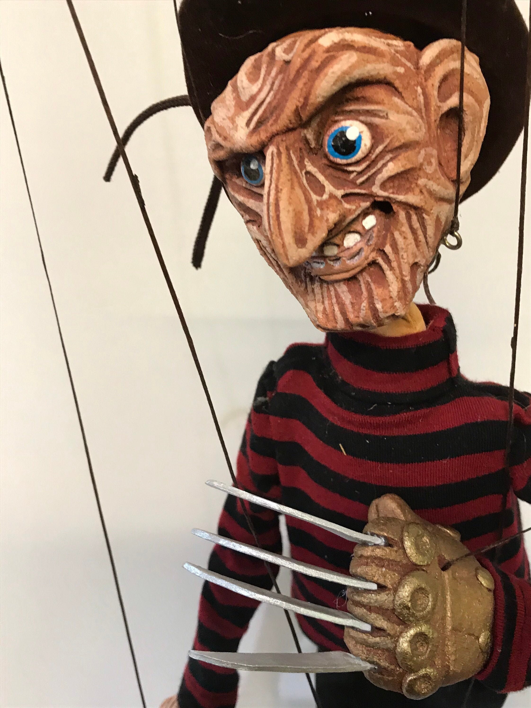 Puppet Combo with Asian Freddie Krueger · Creative Fabrica