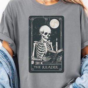 Comfort Colors® The Reader Tarot Card Shirt, Skeleton Reading Shirt, Unisex Tarot Card Shirt, Book Lover Gift, Book and Tarot Lover Gift
