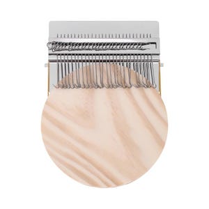 May include: A darning loom tool featuring a circular light-coloured wooden base with a visible grain pattern. Attached to the top is a rectangular metal plate with a series of vertical silver wire hooks arranged in a row for textile repair.