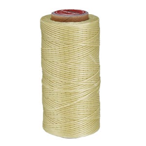 May include: A cylindrical spool of light cream-colored waxed thread wound in a cross-hatch pattern. The top of the spool features a circular label with a red border and the text "FIL AU CHINOIS" printed in white on a dark background.