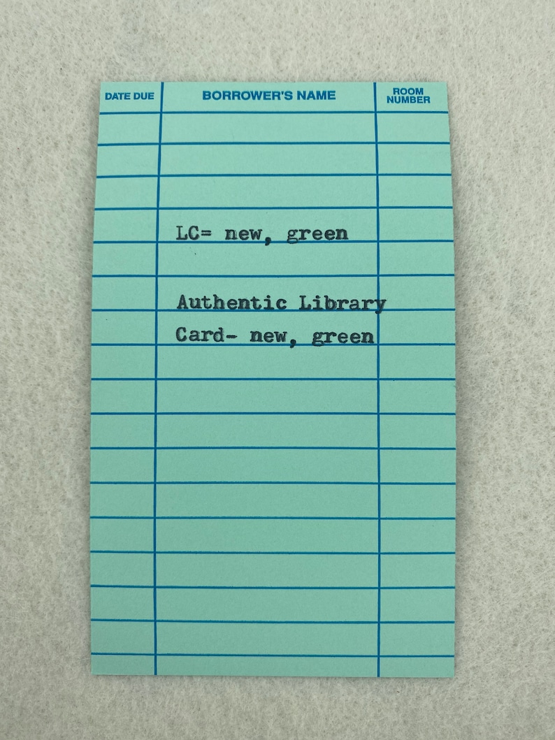 May include: A light blue library card with the text "LC= new, green" and "Authentic Library Card- new, green".