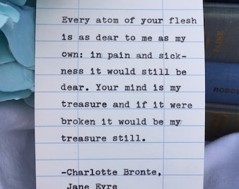 Puede incluir: Una tarjeta rectangular blanca con líneas horizontales azules que presenta un texto negro estilo máquina de escribir: Every atom of your flesh is as dear to me as my own: in pain and sickness it would still be dear. Your mind is my treasure and if it were broken it would be my treasure still. -Charlotte Bronte, Jane Eyre.