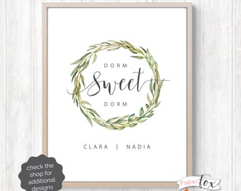 May include: A printable dorm room sign with a green leafy wreath and the text "Dorm Sweet Dorm" with the names Clara and Nadia below. The sign is personalized and printable.