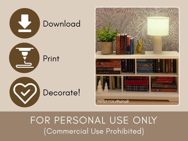 May include: A miniature white bookshelf filled with books, a lamp, and decorative items. The bookshelf has multiple shelves and is set against a patterned wallpaper. A small potted plant and a gold figurine are also visible.