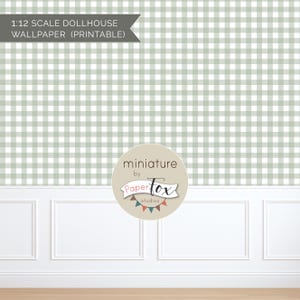 May include: Printable 1:12 scale dollhouse wallpaper featuring a light green and white gingham pattern. The wallpaper is displayed above a white wainscoting and a wooden floor. The PaperTox Studios logo is in the lower center.