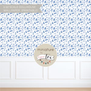 May include: Printable 1:12 scale dollhouse wallpaper featuring a repeating pattern of blue nautical elements on a white background. The design includes sailboats, lighthouses, starfish, and beach chairs. The wallpaper is from PaperTox studios.