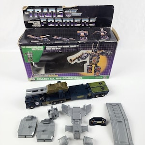 Combinador Transformers Onslaught G1 1986 100 % completo con caja (mala) Bruticus