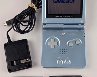Nintendo Gameboy Advance SP AGS-101 Pearl Blue z grami i ładowarką Bright Button