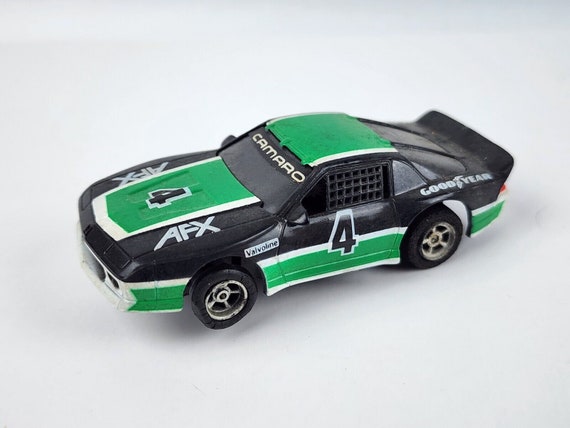Aurora AFX Black & Green Chevy Camaro #4 HO Slot Car Nice Body
