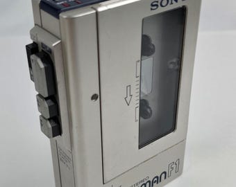 Vintage Sony Walkman F1 WM-F1 Cassette Player AM/FM Radio Works Plays (slow)