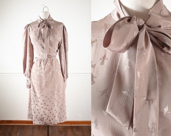 dress with bow at neck