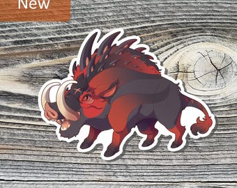 May include: A sticker featuring a stylized illustration of a fierce, red and black boar with large tusks. The sticker has a white border and the word "New" is in a brown rectangle in the upper left corner. The sticker is on a wooden background.