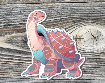 May include: A colorful sticker featuring a stylized turtle with a long neck and a spiky shell. The turtle has a pink and blue color scheme, with a smiling expression. The sticker is on a wooden background.