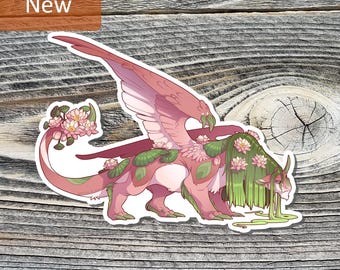 May include: A sticker featuring a mythical creature with pink and green floral accents. The creature has large wings, a long tail, and a flowing mane. The word "New" is in a brown rectangle in the upper left corner.
