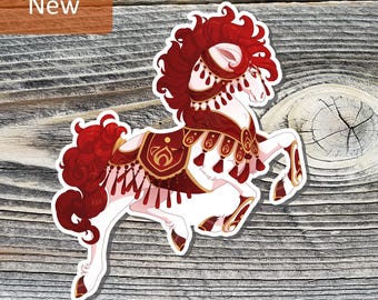 May include: A sticker featuring a white horse with red mane and tail, adorned with a decorative red and gold harness. The sticker has the word "New" in a brown rectangle in the upper left corner. The horse is set against a wood grain background.