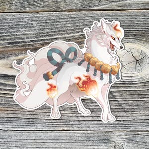 May include: A white fox with a blue and white ribbon around its neck and a gold beaded necklace. The fox has a fluffy tail and flames around its body.