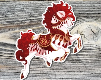 May include: A sticker featuring a white horse with red and maroon accents. The horse has a flowing red mane and tail, and is adorned with decorative maroon and gold tack. The sticker is on a wooden background.