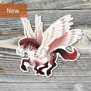 May include: A sticker featuring a winged horse with a white body, red and brown mane and tail, and large white wings with red accents. The word "New" is in a brown rectangle in the upper left corner. The sticker is on a wooden background.