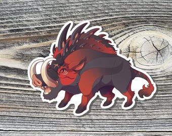 May include: A sticker featuring a stylized illustration of a fierce, red and black boar with large tusks. The sticker has a white border and is set against a wooden background. The boar has a spiky mane and a determined expression.