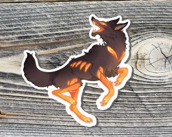 May include: A sticker featuring a stylized illustration of a wolf-like creature with a dark brown body and glowing orange accents. The creature is in a dynamic pose, with its mouth open and legs extended, set against a wood grain background.