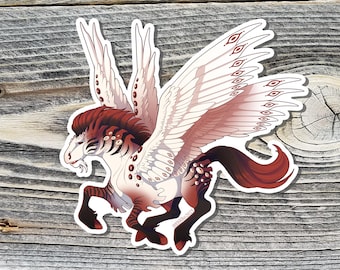 May include: A sticker featuring a stylized illustration of a winged horse, or pegasus, in shades of white, red, and brown. The pegasus has large, detailed wings with eye-like markings. The sticker is on a wooden surface.