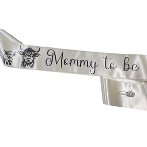 JOYMEMO Blue Highland Cow "Mom To Be" Sash – Satin Baby Shower Sash For Gender Reveal Parties - View #4