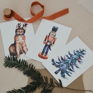 Illustration aquarelle de cartes postales de Noël | sapin de Noël, chat et casse-noix
